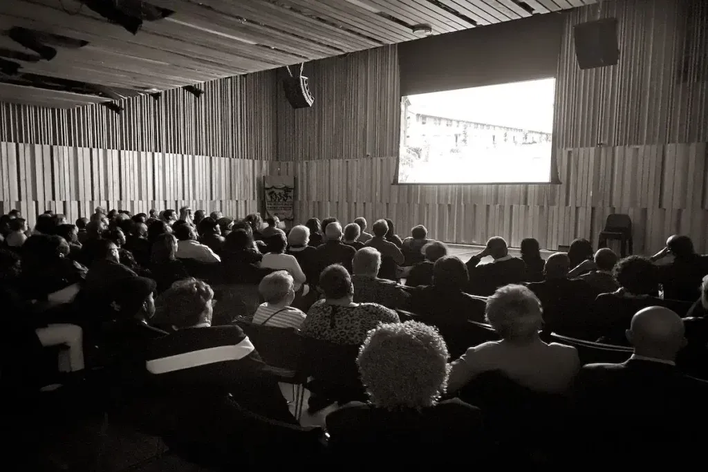 Audience watching a community screening of A Place Called Desire