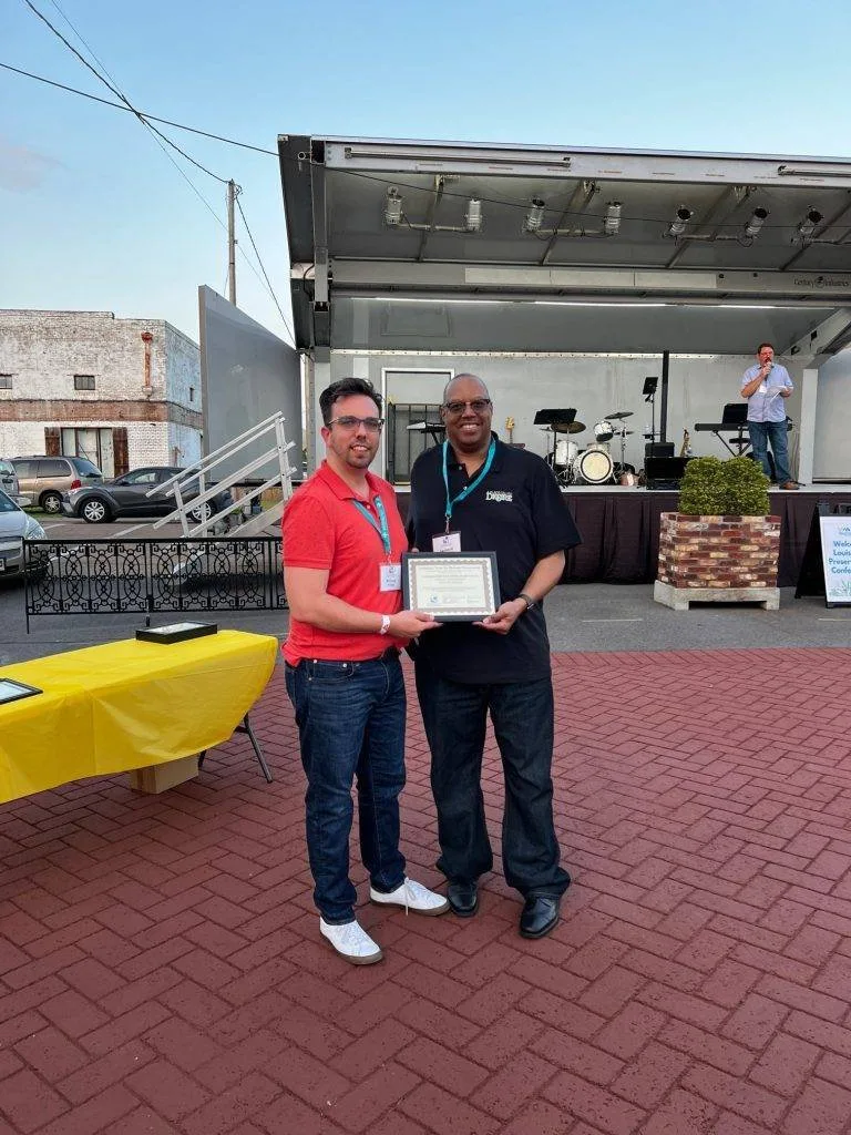 William Prince presents the Louisiana Trust for Historic Preservation Media Award to Leonard Smith III