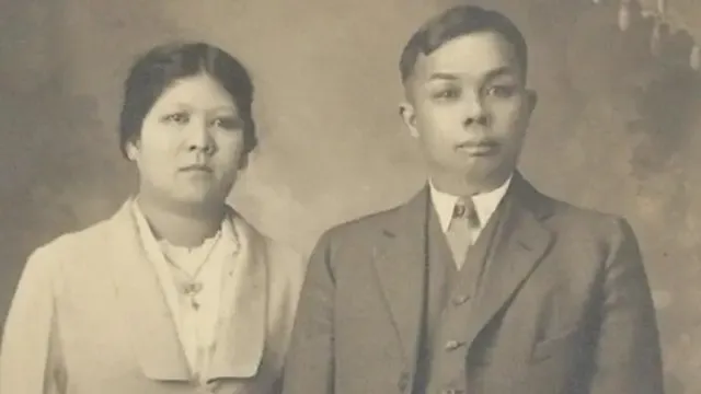 Sepia archival portrait of a couple from the film From Shanghai to Harlem
